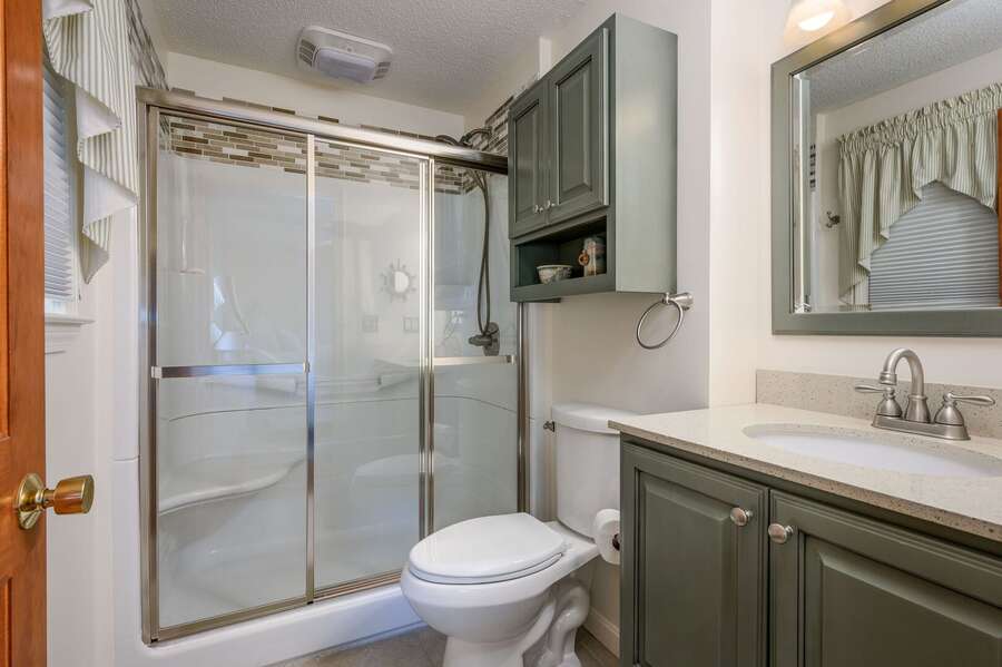 Bathroom Two is a full bathroom with shower and en suite to Bedroom Three - 40 Willow Street West Harwich - Waves on Willow - NEVR