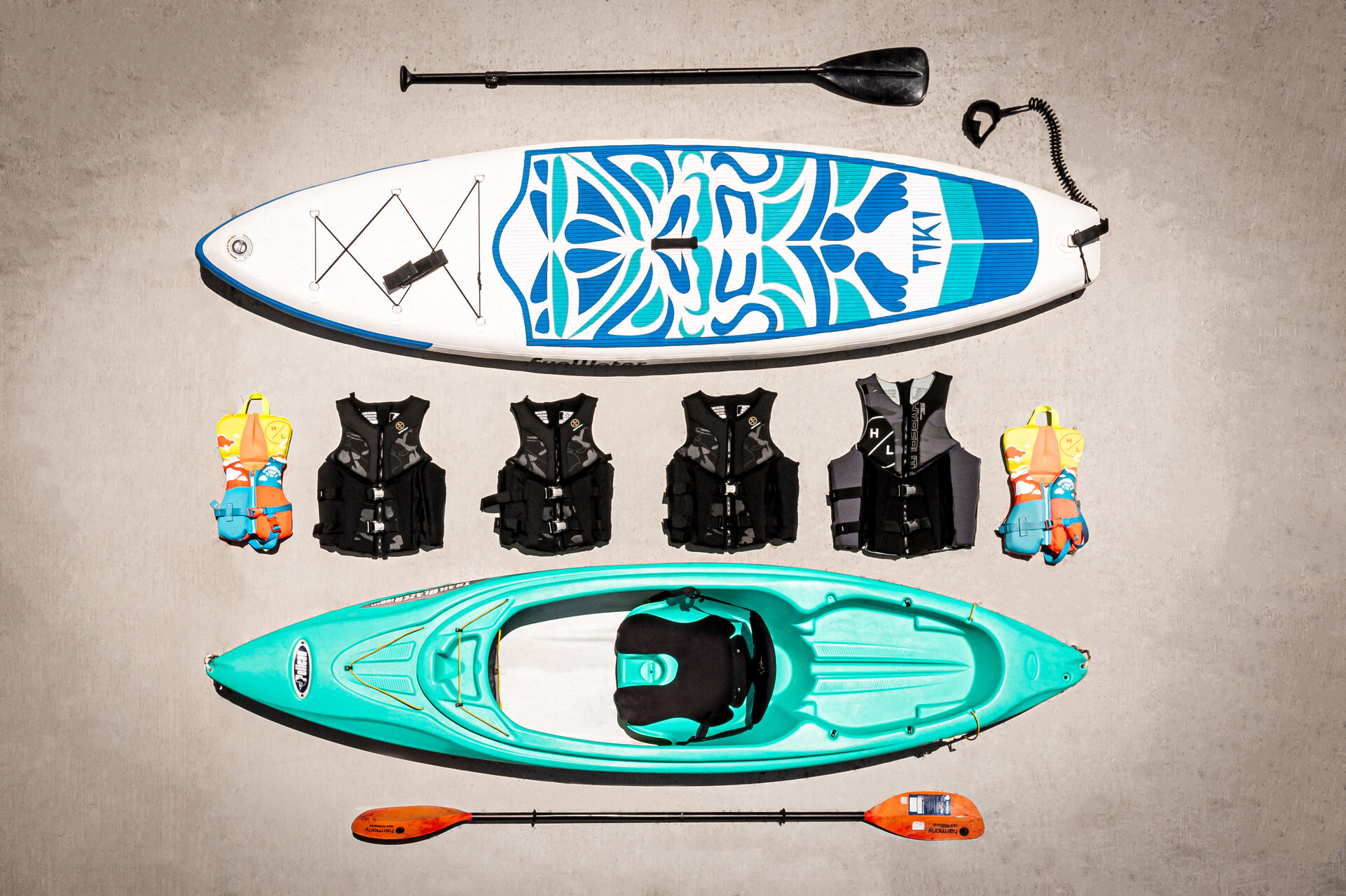 There are two blow-up, stand-up paddle boards, 1 kayak, 2 kids and 4 adult new life jackets