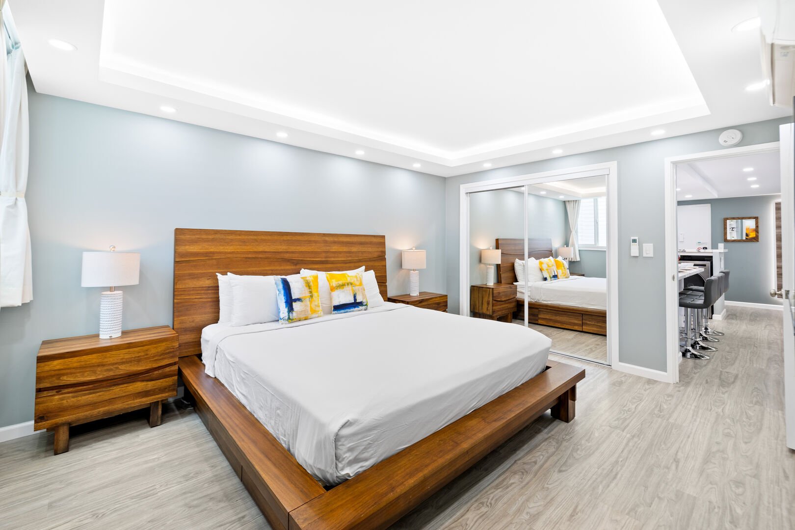 The master bedroom features a king-size bed, 2 nightstands, flat screen TV, own bathroom, and a split AC!