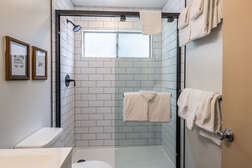 Full Shower Bathroom - Downstairs , Just outside both bedrooms