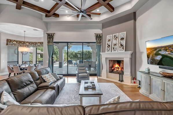 Living Room with Leather Reclining Sectional, Smart TV, Gas Fireplace and Large Pocket Patio Door