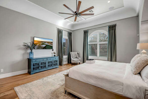 Spacious Grand Master Suite with King Bed, Smart TV and French Doors Leading to Back Patio