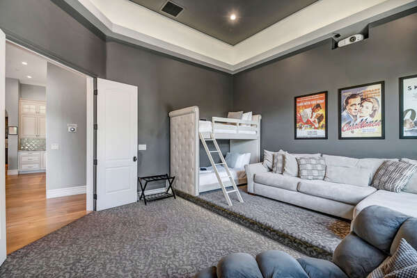 Bedroom Five/Theater Room- Twin over Twin Bunk, Sectional Seating and Large Projector to Enjoy Some of Your Favorite Films!
