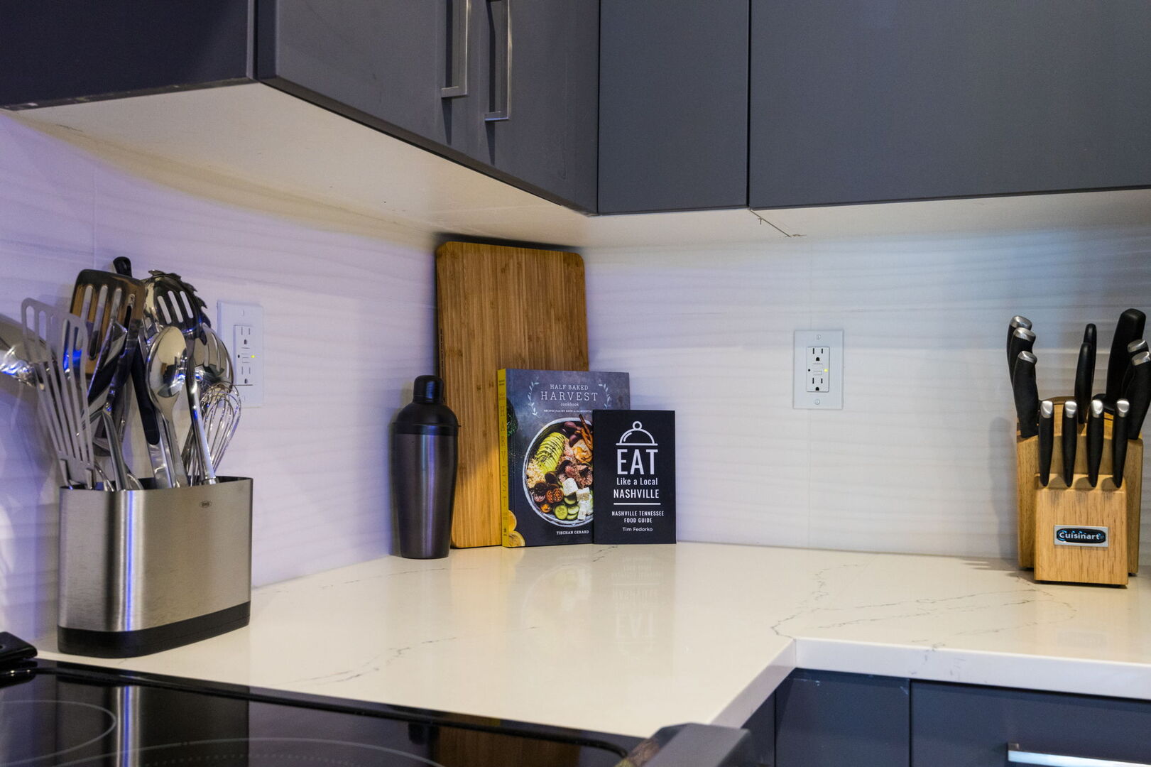 Fully equipped kitchen featuring stainless-steel appliances and stocked with culinary essentials for ease and convenience during your stay.