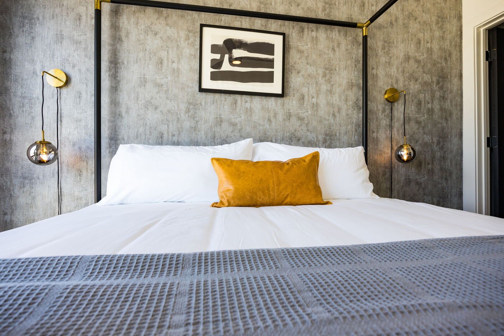 The primary bedroom is a lavish sanctuary featuring a spacious King bed and floor-to-ceiling windows. It's equipped with a Smart TV for entertainment, a luxurious en-suite bathroom for convenience, and a walk-in closet to accommodate all your belongings.