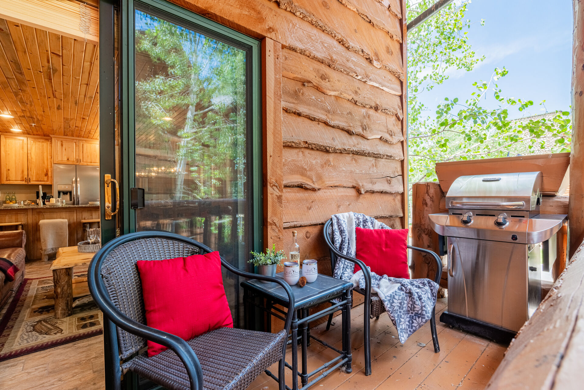 Private balcony with outdoor seating and propane grill