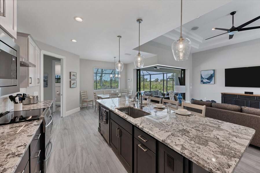 Spacious kitchen open to the living area and overlooking the pool