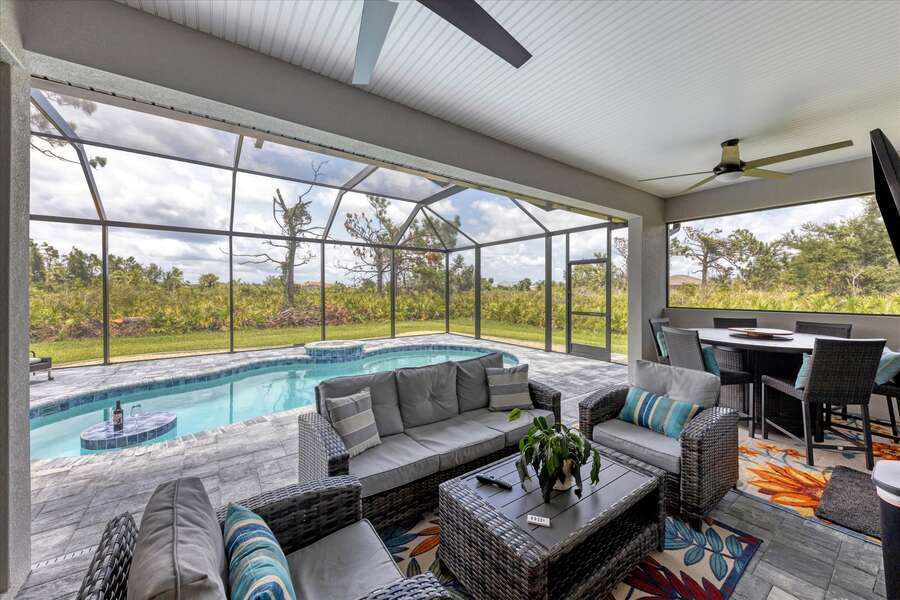 The perfect outdoor living space, with comfortable seating overlooking the pool