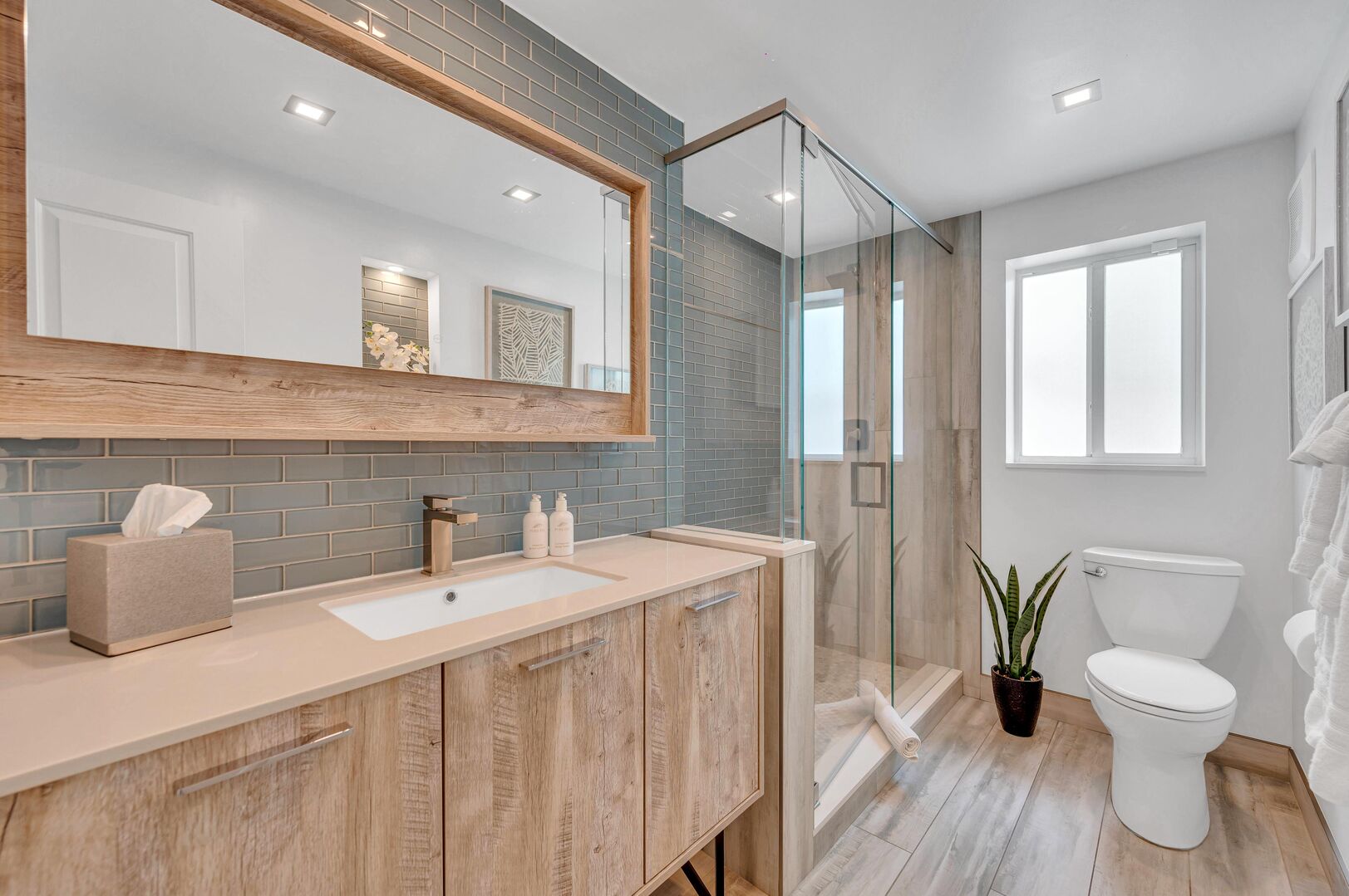 Indulge in luxury and convenience with our first-floor guest bathroom, featuring a stunning walk-in shower designed to elevate your stay to new heights.