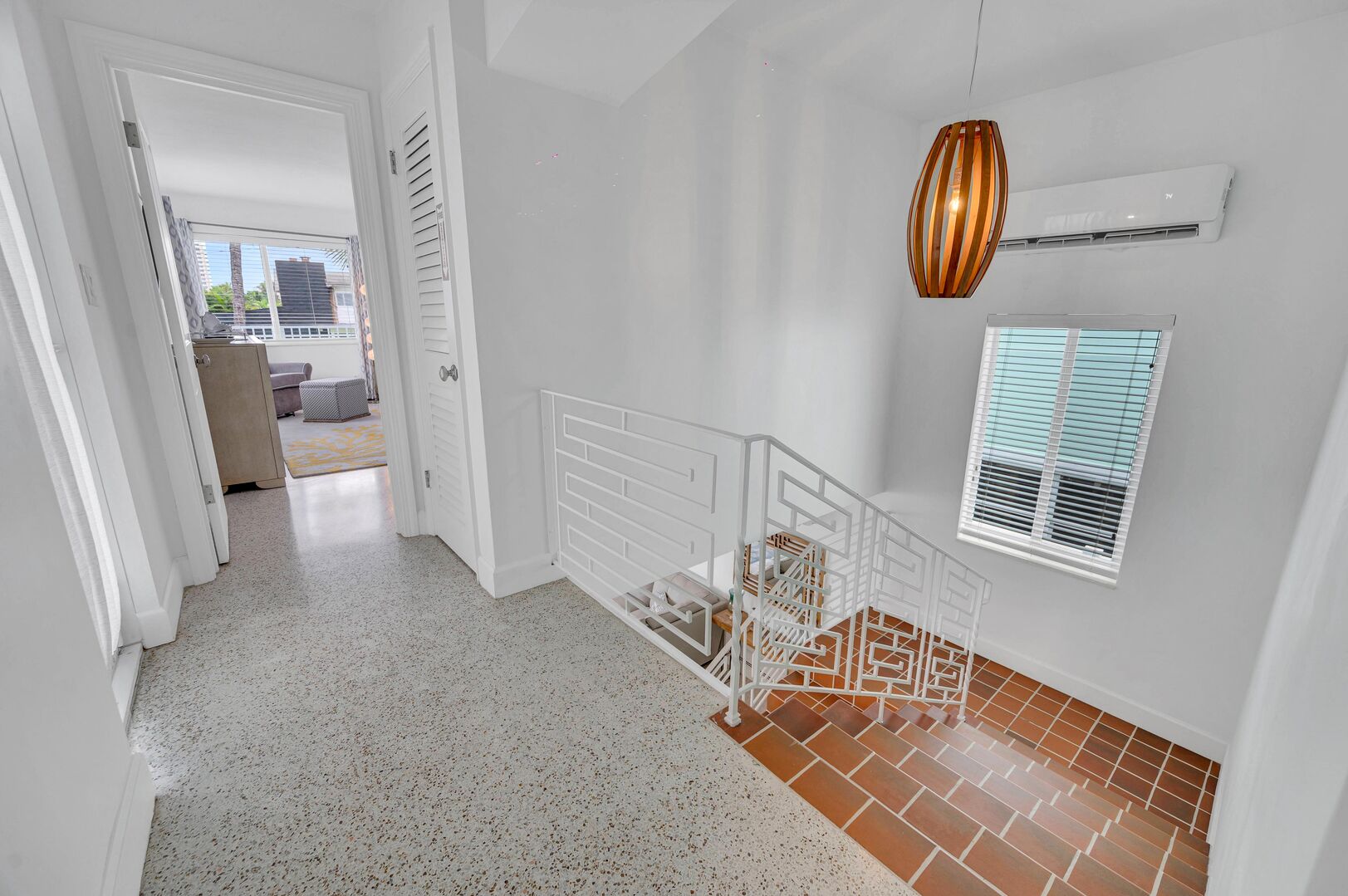 Make your way up the stairs to two more bedrooms and a second outdoor dining area.