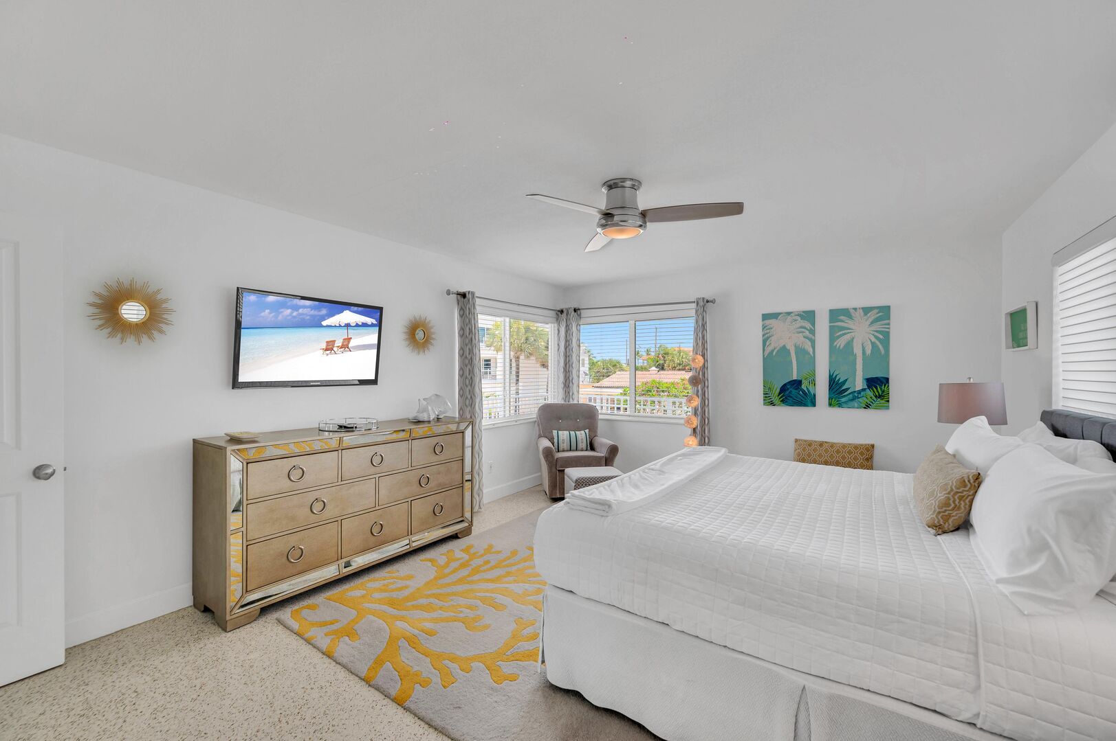 The second bedroom is a spacious king room, adorned with a plush bed and a smart TV for your ultimate relaxation.
