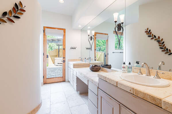 Master En Suite Bathroom with Dual Sinks, Wrap Around Shower and Access to Backyard Spaces