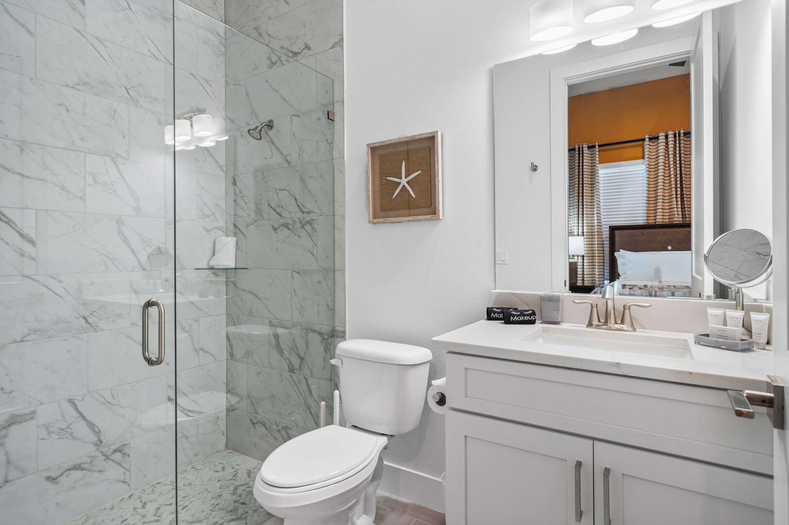 Updated bathroom with a frameless mirror