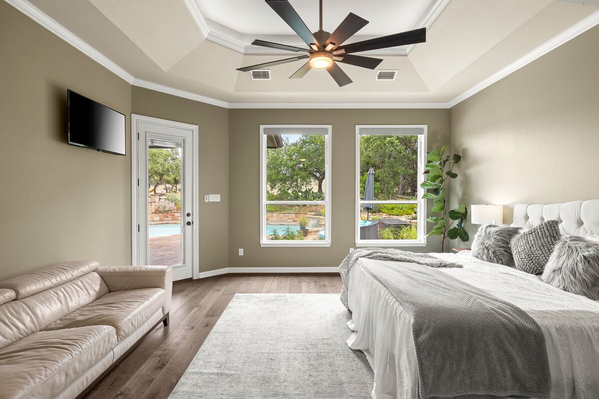 Experience the grandeur of our Master Suite, which provides direct access to the covered patio and pool area.
