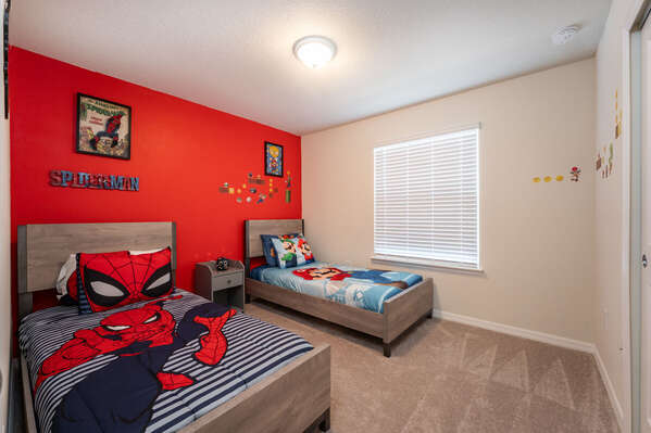 Bedroom 3 has a superhero theme and twin beds