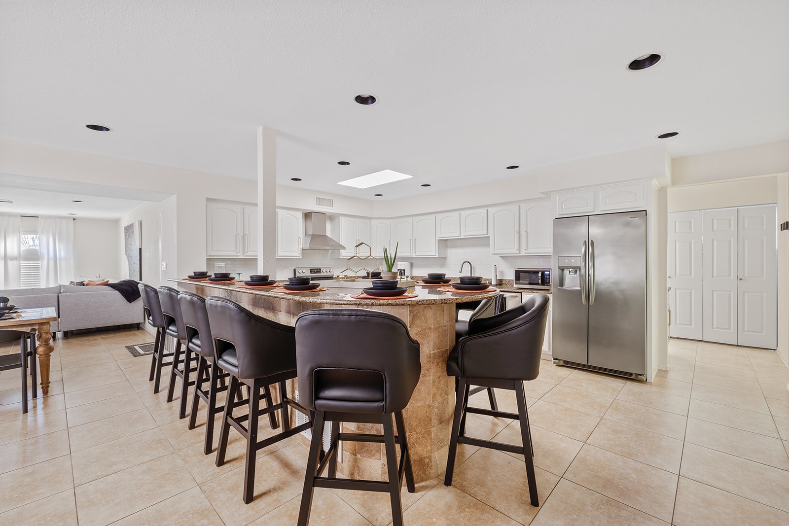 Open kitchen with ample bar seating.