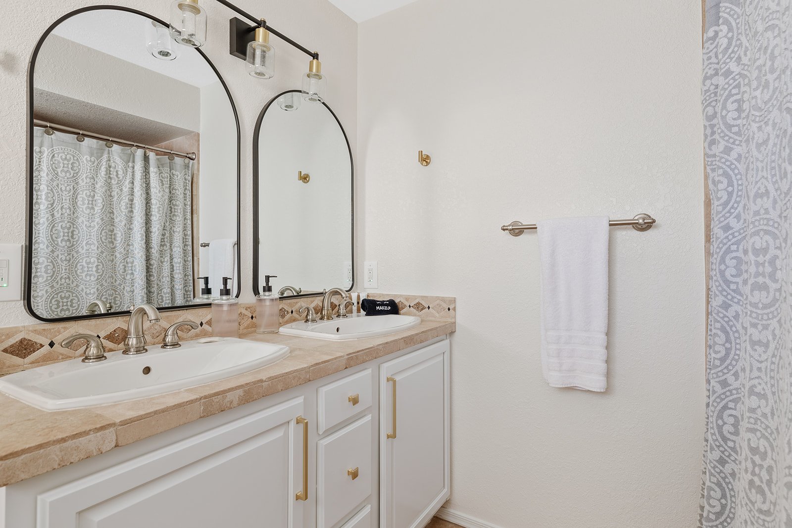 Secondary ensuite includes double vanity, walk in closet, shower/tub combo.