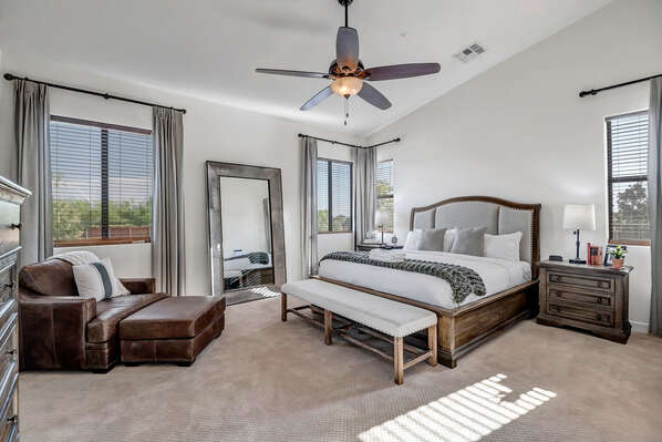 Master Bedroom with King Bed, Chaise Chair and Smart TV