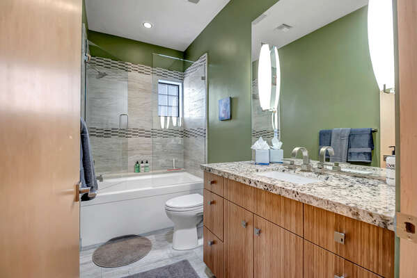 Shared full bath with glass shower/tub combo