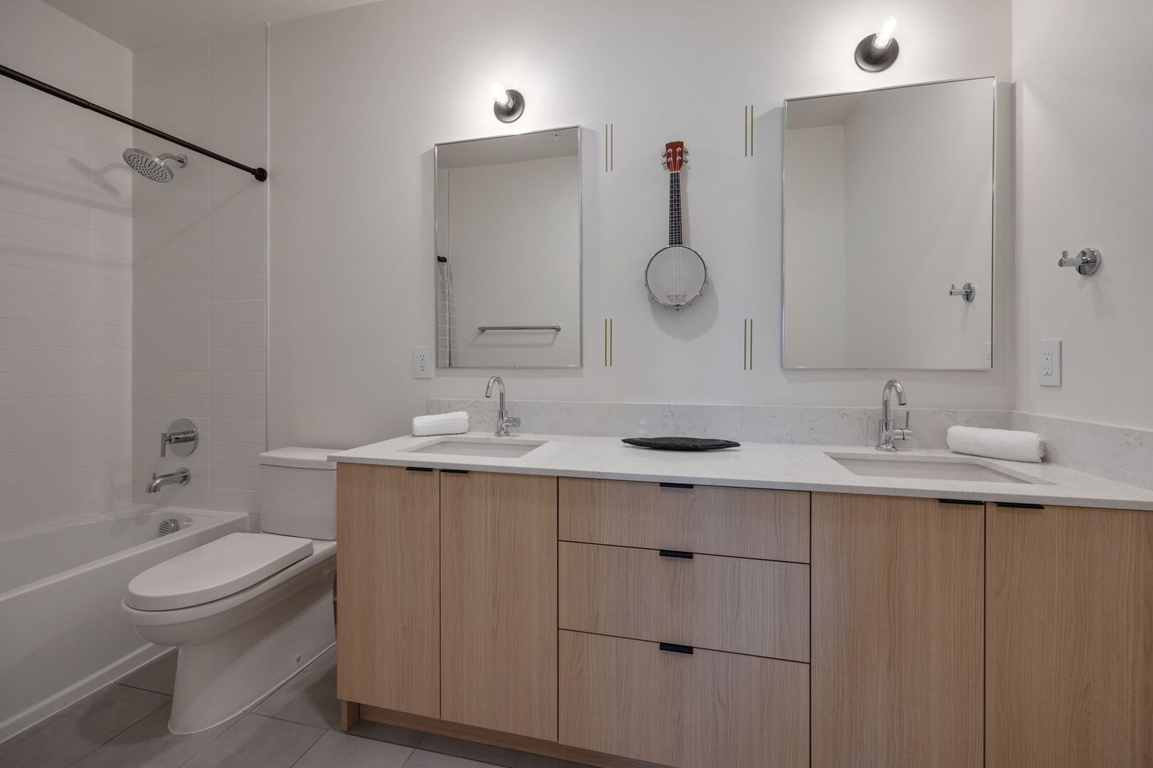 Primary Bathroom (Primary Bedroom en-suite) with dual vanity and shower/tub combo.