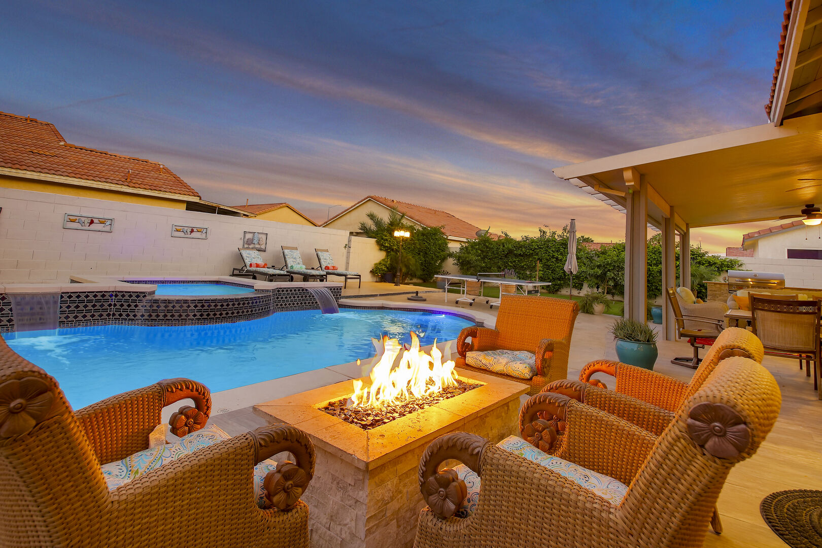 Relax by the cozy natural gas fire pit with seating for four.