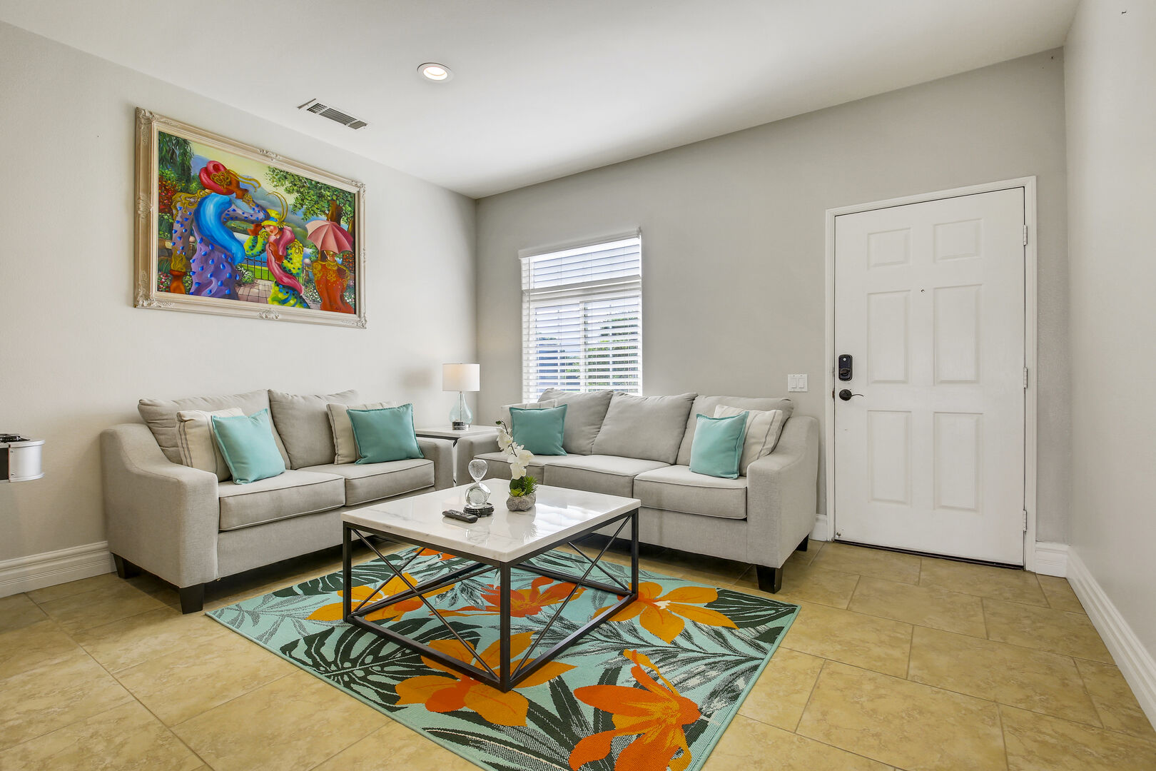 Enter this vacation home and step into a spacious living room seamlessly connected to a family kitchen.