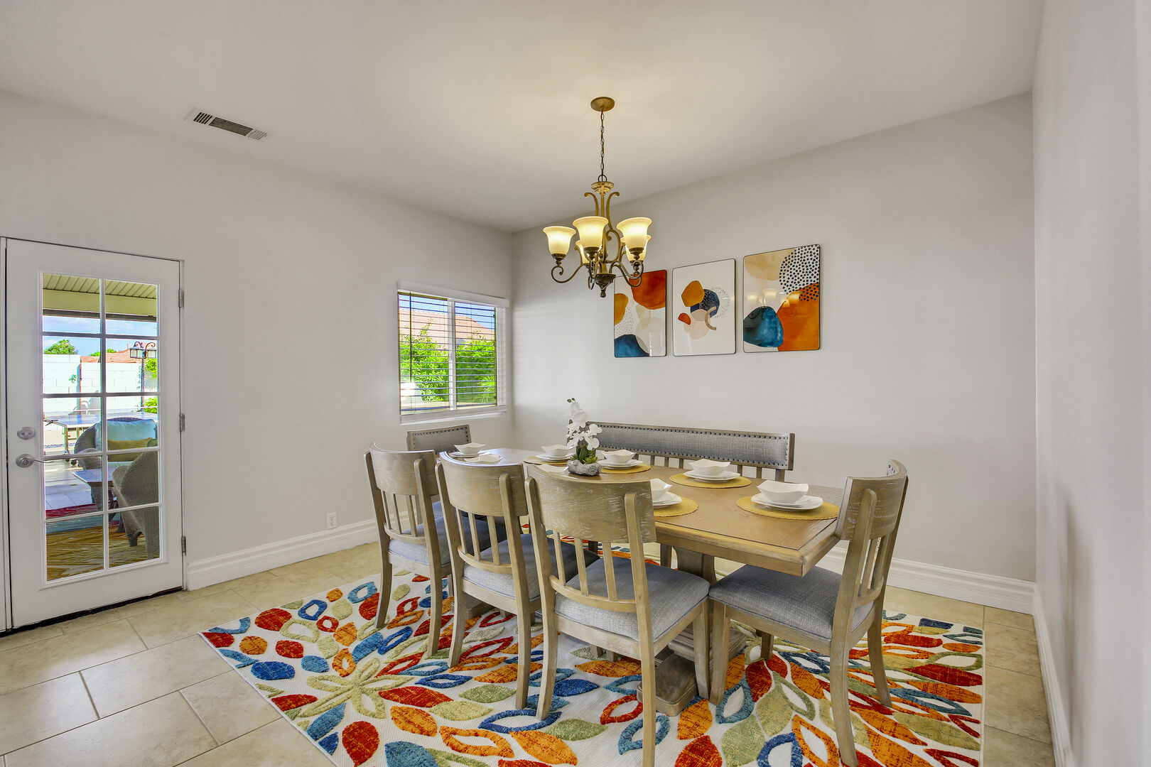 The casual dining room features a dining table accommodating eight guests.