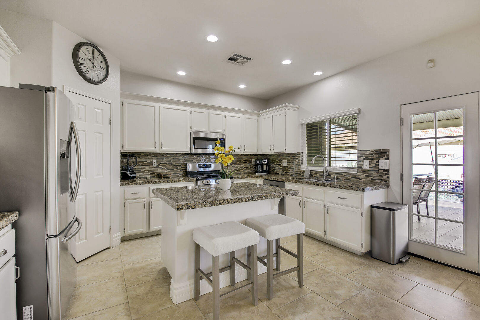 The fully-equipped kitchen boasts stunning stainless steel appliances.