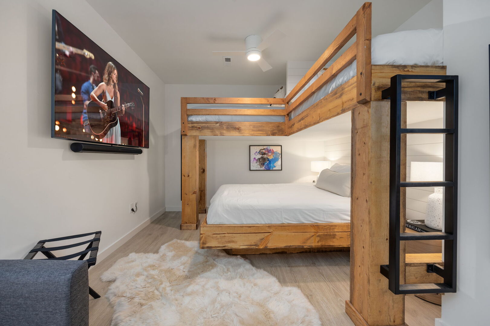 Main Level: 4th bedroom with 2 Twins over 1 Queen bed (bunk bed style), smart TV, and 1 Twin size sleeper sofa.