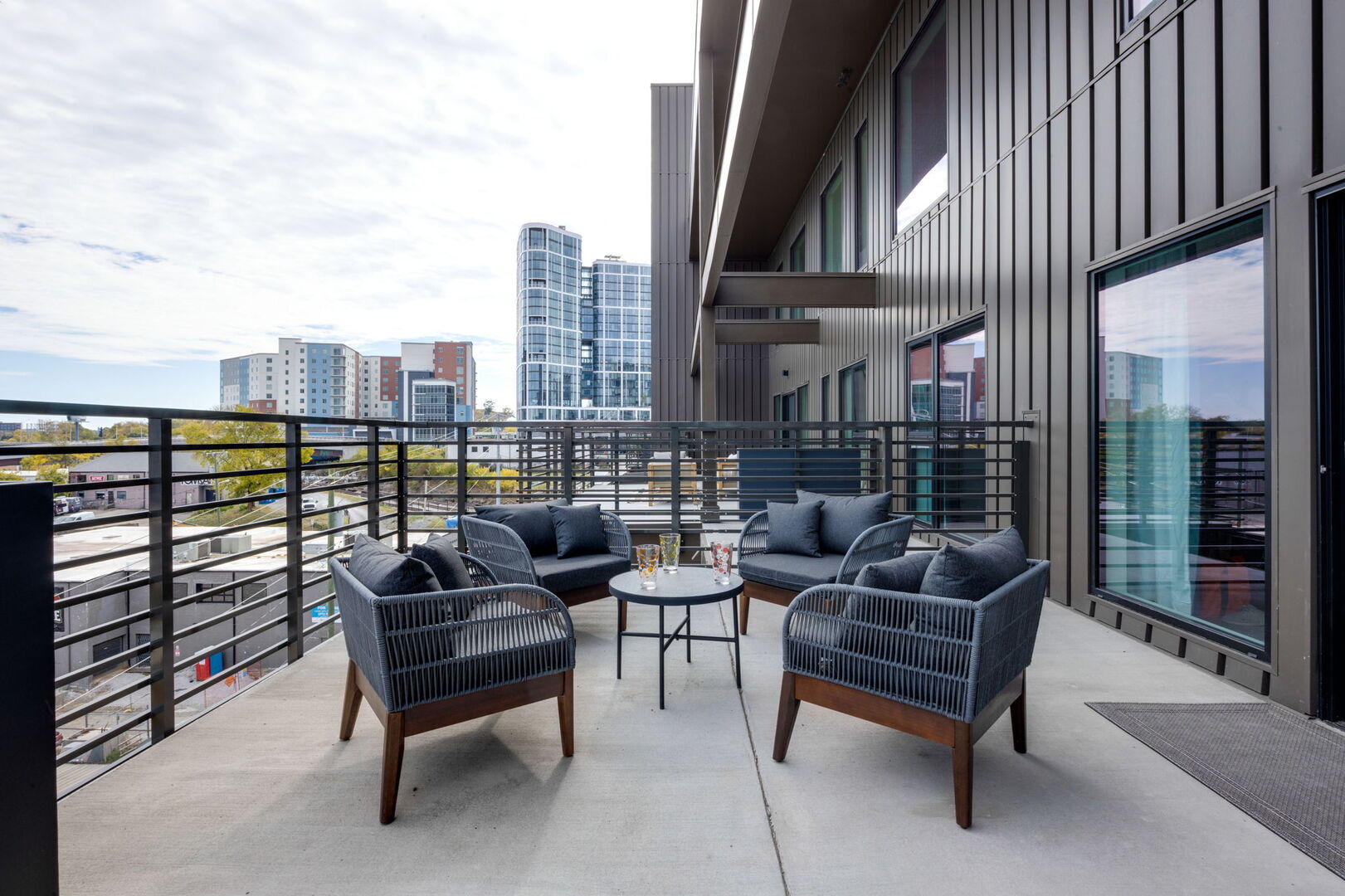Main Level: Large private patio with a large lounge area, cornhole, giant Jenga, and additional seating overlooking the Nashville skyline.