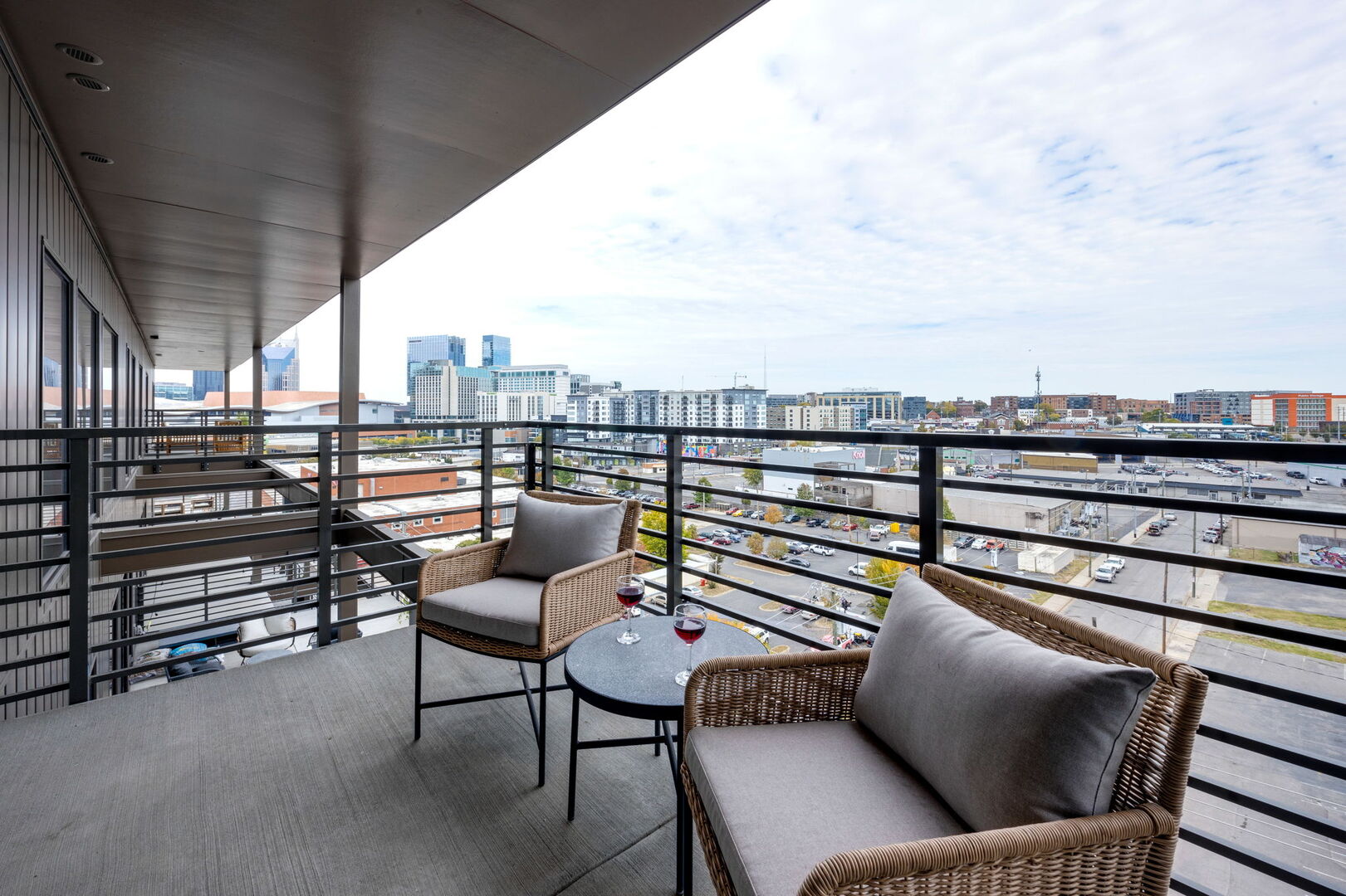 Upper Level: Primary bedroom with its own private balcony overlooking the Nashville skyline.