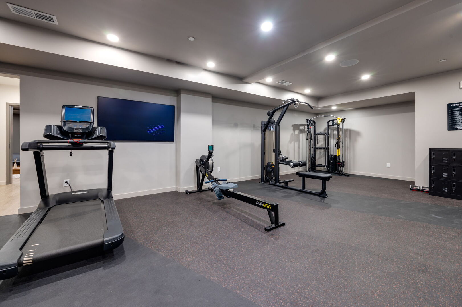 Communal Area: Gym offering a wide range of workout equipment and a Smart TV.