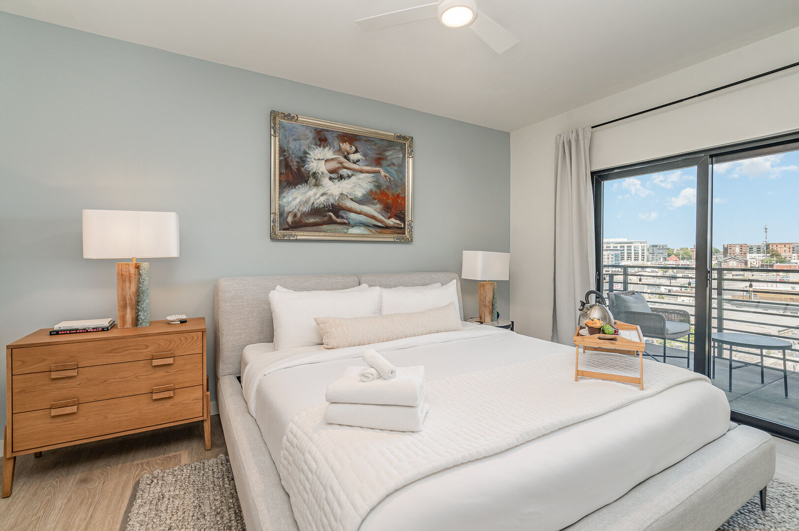 Upper Level: Primary bedroom with King bed, en-suite bathroom, walk-in closet, and its very own private balcony. The bedroom overlooks the living area.
