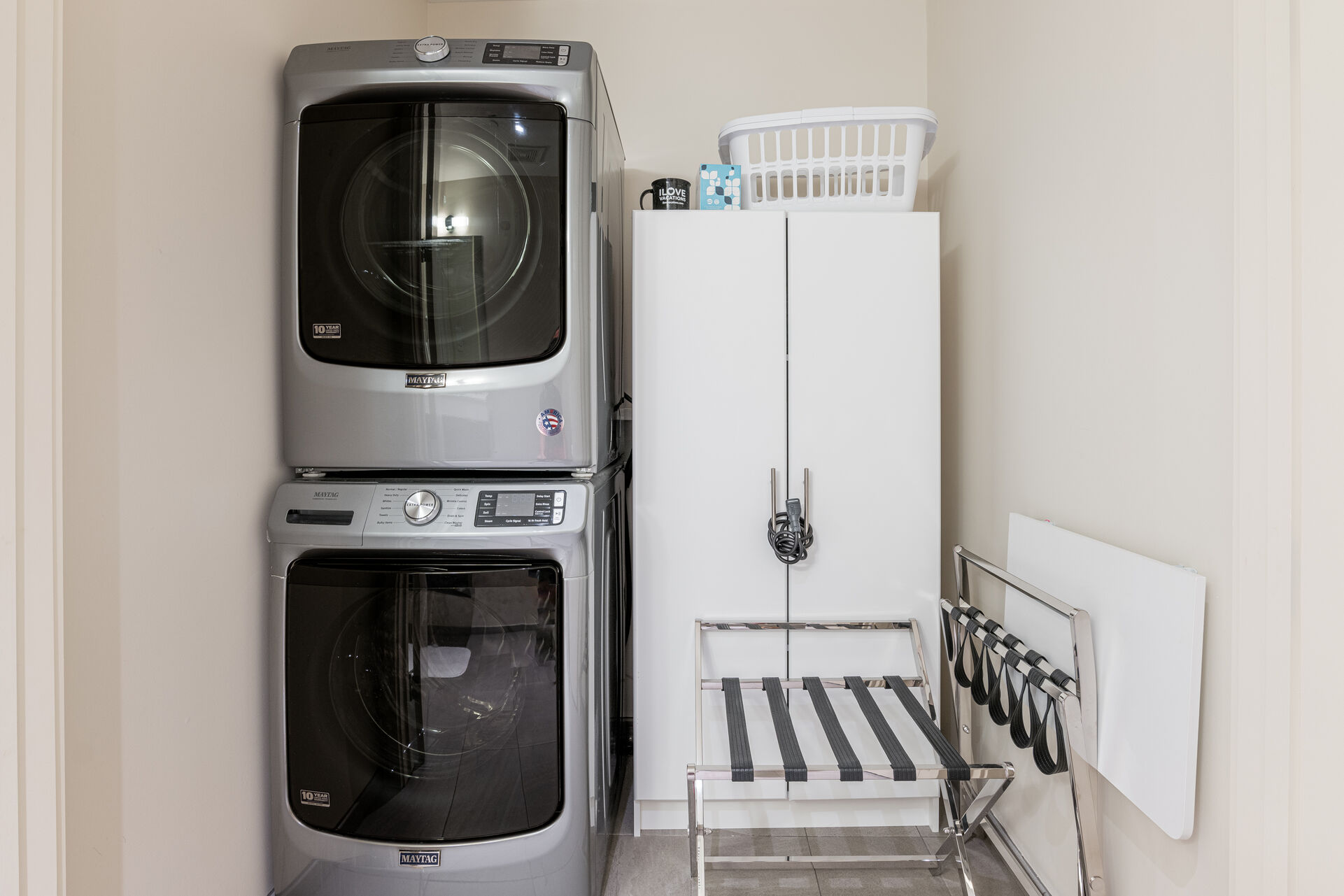 Stacked washer and dryer located in the half bath