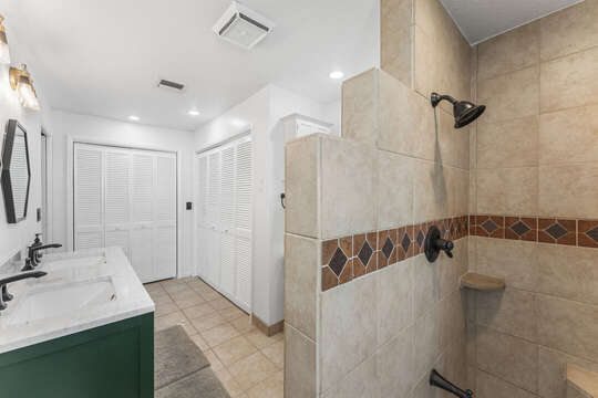 Master bathroom with his and hers sinks and a big shower