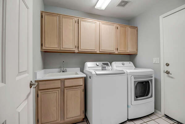 Laundry Room with Utility Sink and Washer and Dryer
