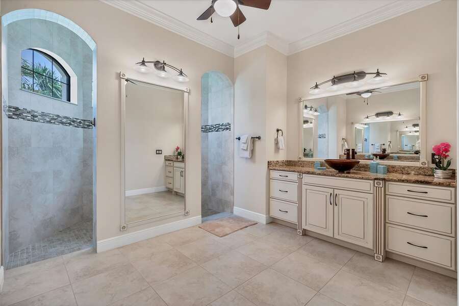 Huge master bathroom with walk-in shower and dual vanities