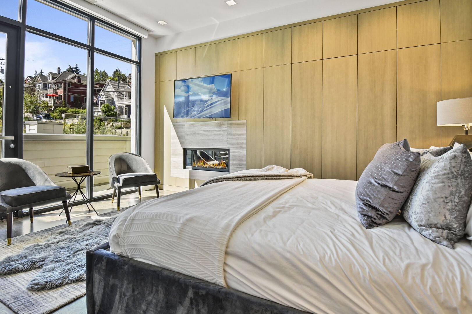 Master suite enjoys plenty of natural light from floor-to-ceiling windows.