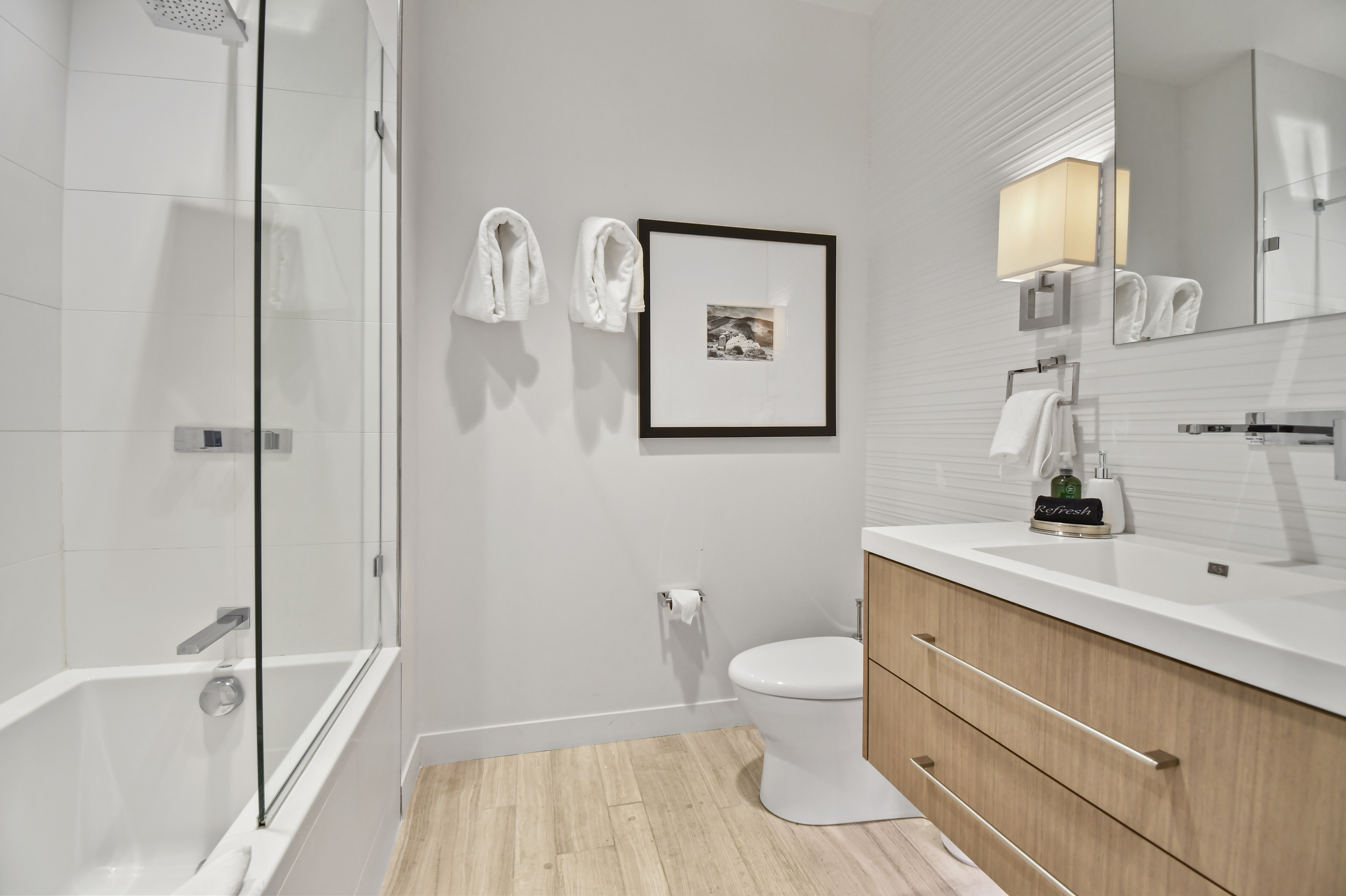 Ensuite bathroom with combination shower and bathtub.