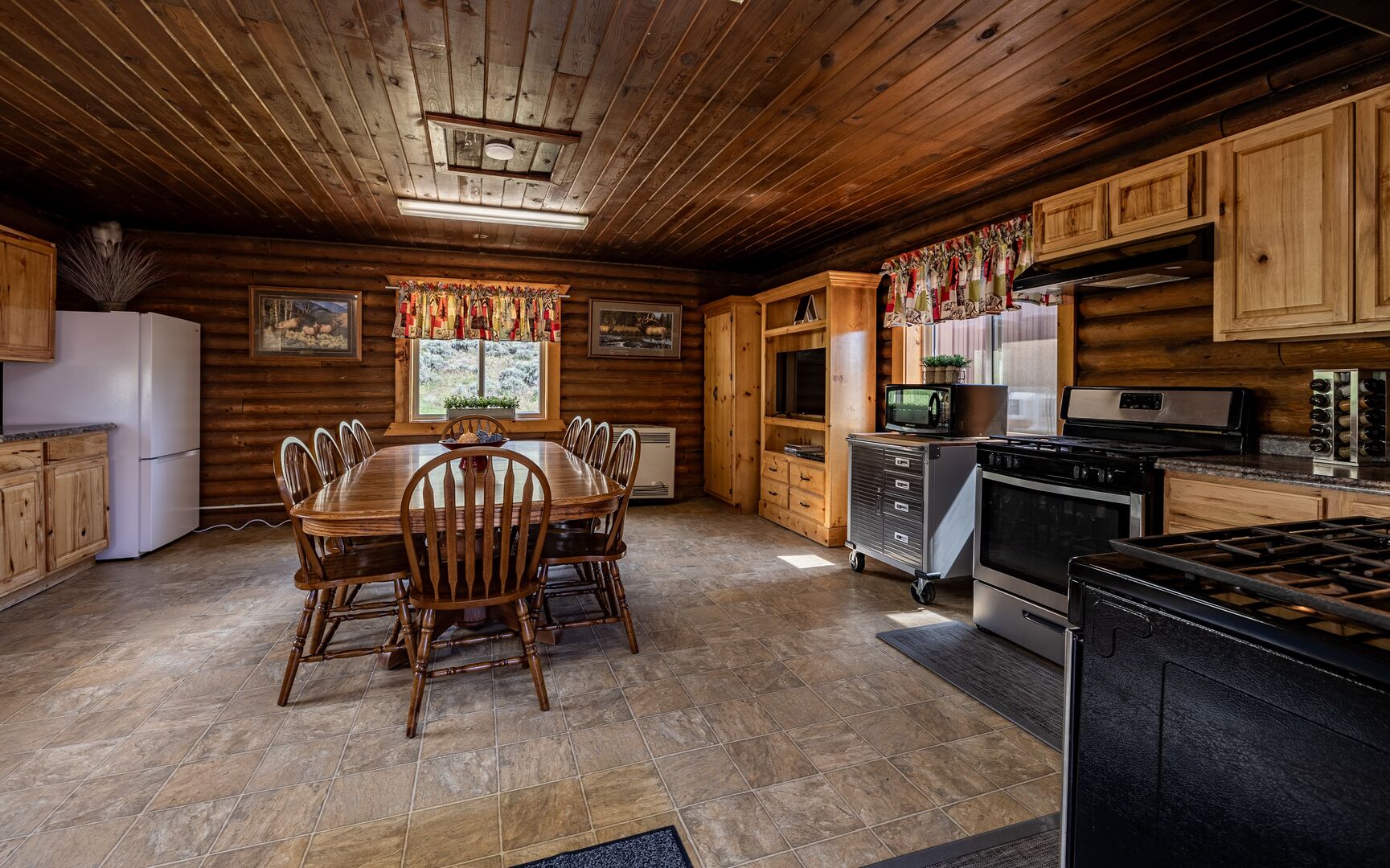 Dining cabin features a full kitchen with two ranges and seating for 10 guests