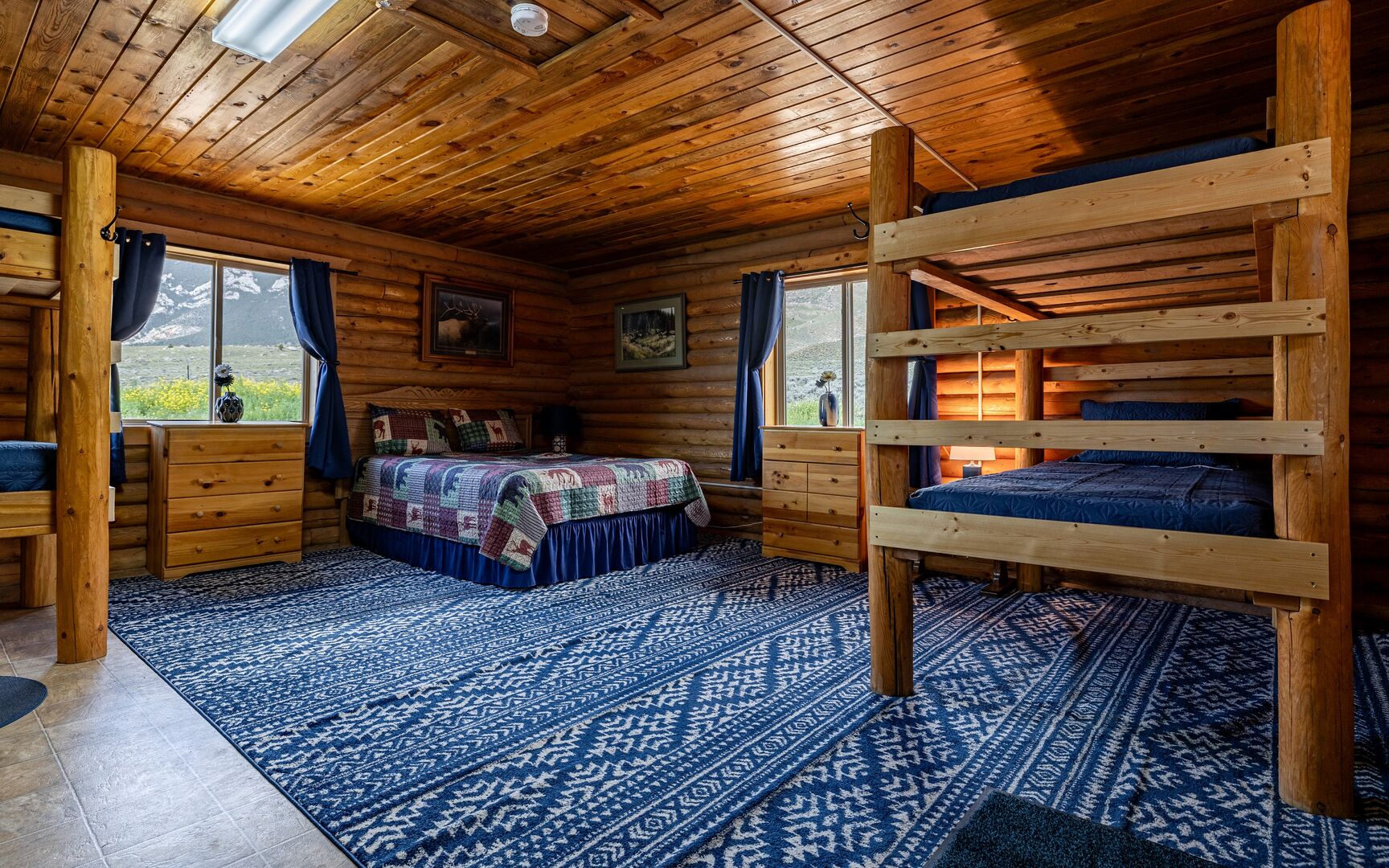 Guest Cabin 1 features a full size bed and 2 twin bunkbeds (4 twin size beds).