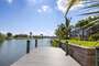Spacious dock in the South Gulf Cove Canal system- guests are welcome to tie up their boats here