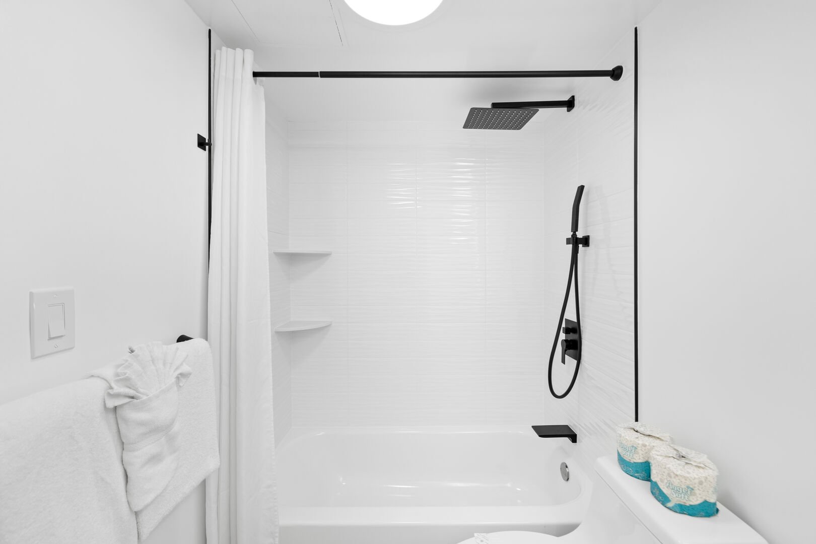 Freshen up in this full bathroom with a shower and tub combination!