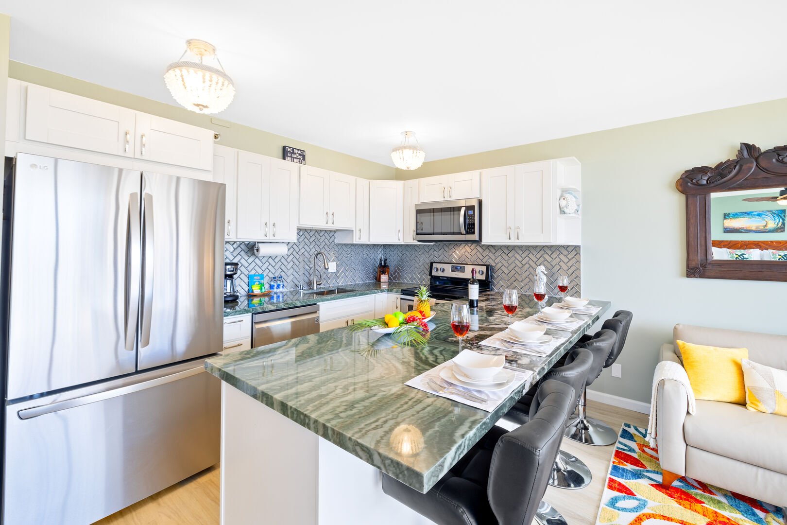 The full-equipped kitchen features beautiful Brazilian natural stone countertops and a dining area good for 4!