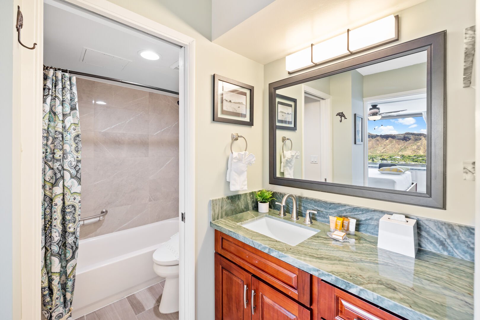Refresh yourself in this full bathroom with a tub/shower combination and a Toto bidet toilet seat!