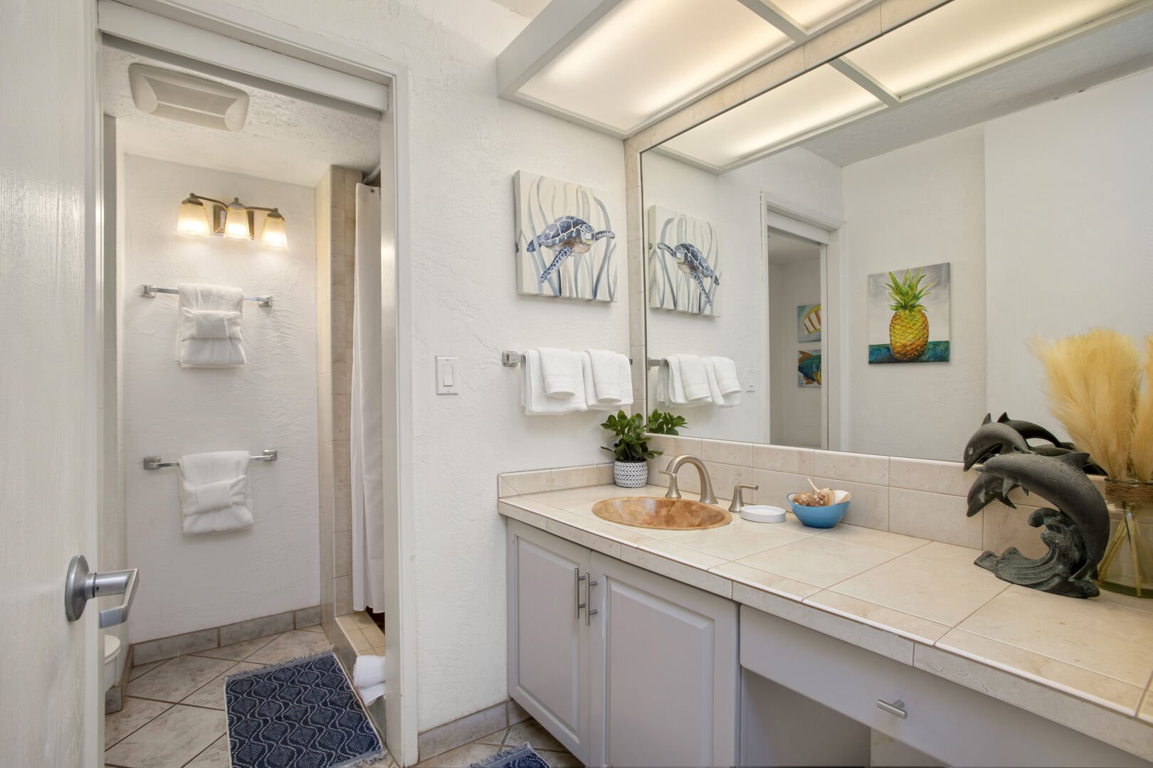 The full bathroom features a vanity with cabinet and a walk-in shower!
