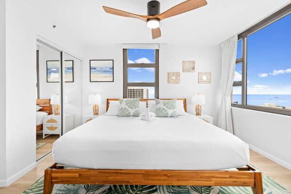 The bedroom has a king-size bed and ceiling fan to keep your cool!