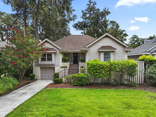 View of front of house with driveway.