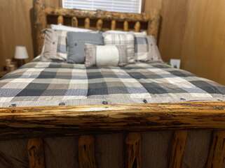 Wood frame bed to give you that rustic surrounding.