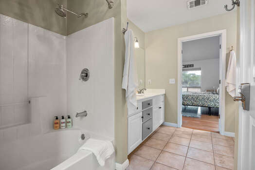 Master bath with a tub/shower combo